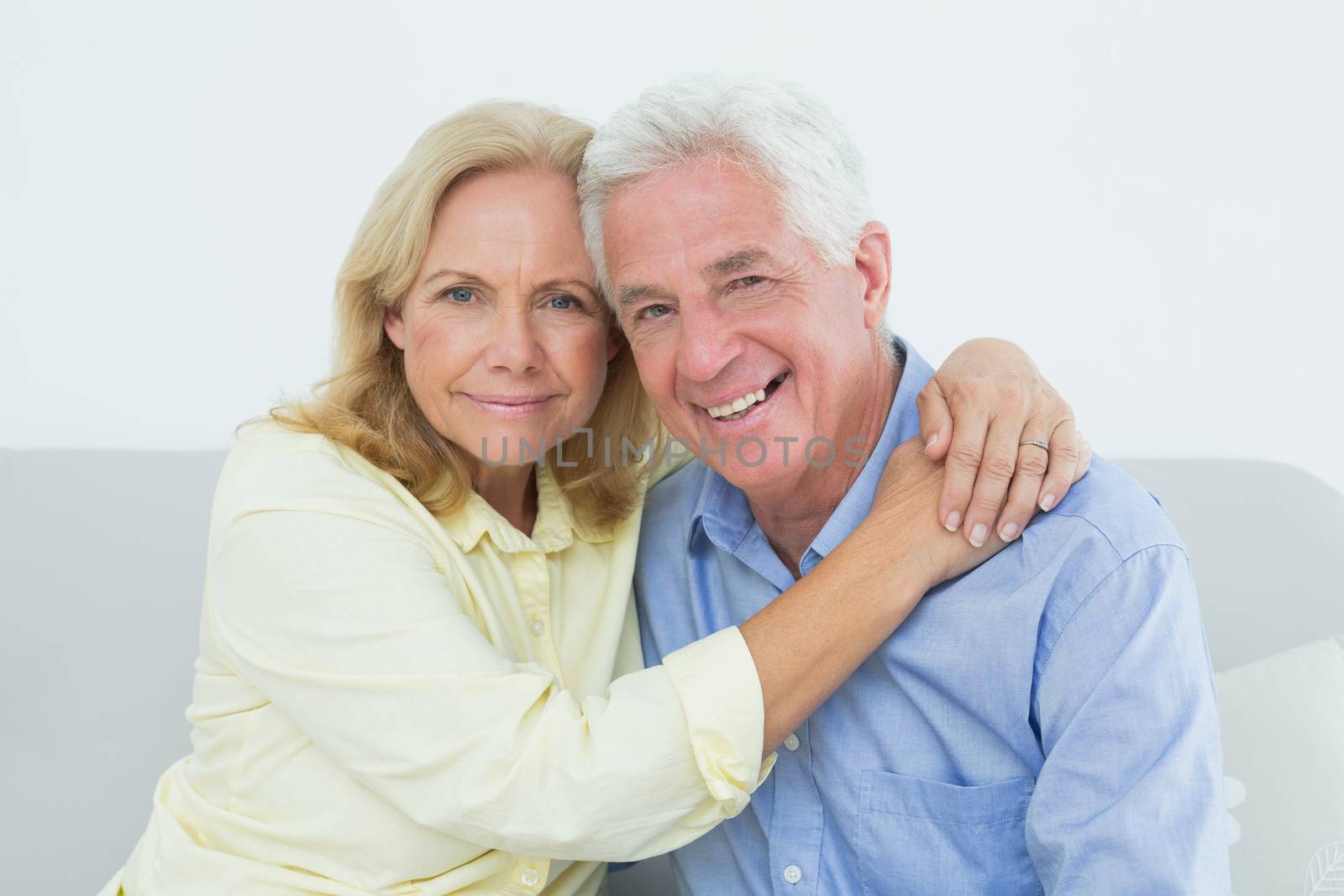 Romantic relaxed senior couple at home by Wavebreakmedia