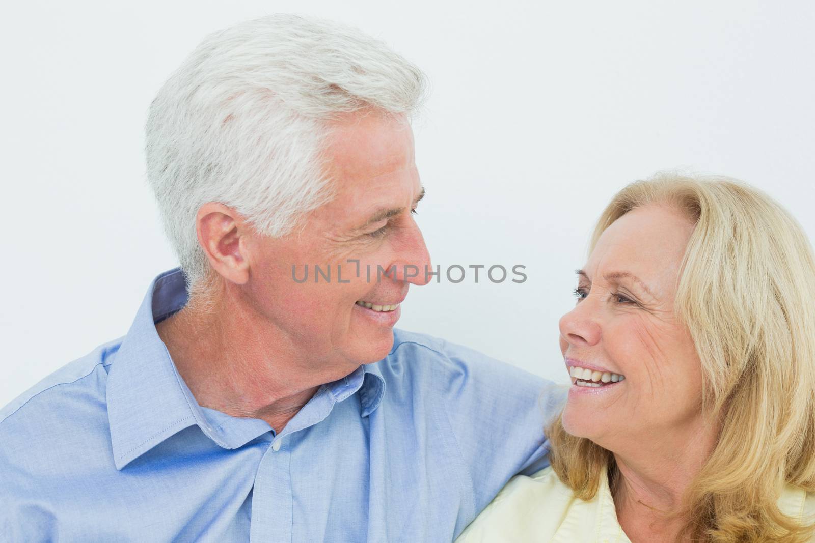 Closeup of a happy romantic senior couple in a house