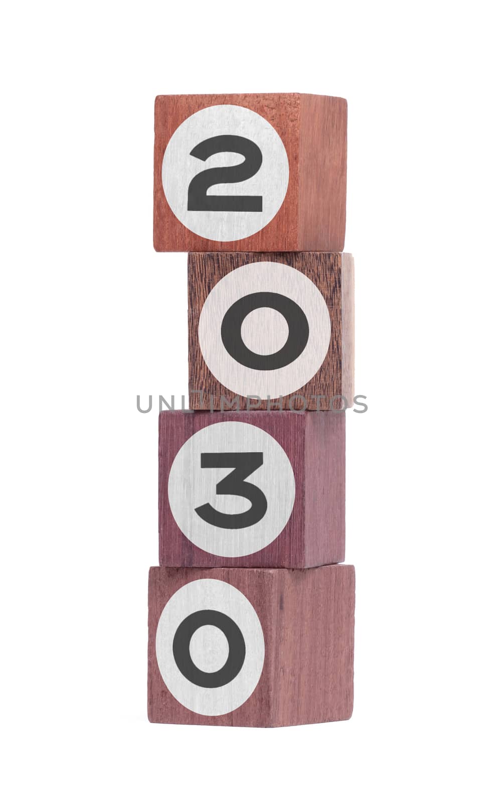 Four isolated hardwood toy blocks on white, saying 2030