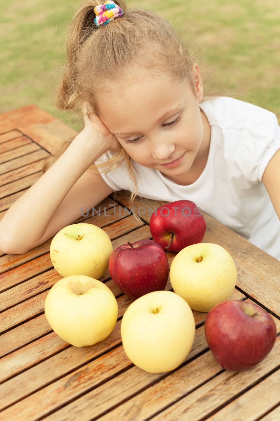 portrait of a happy child with apples