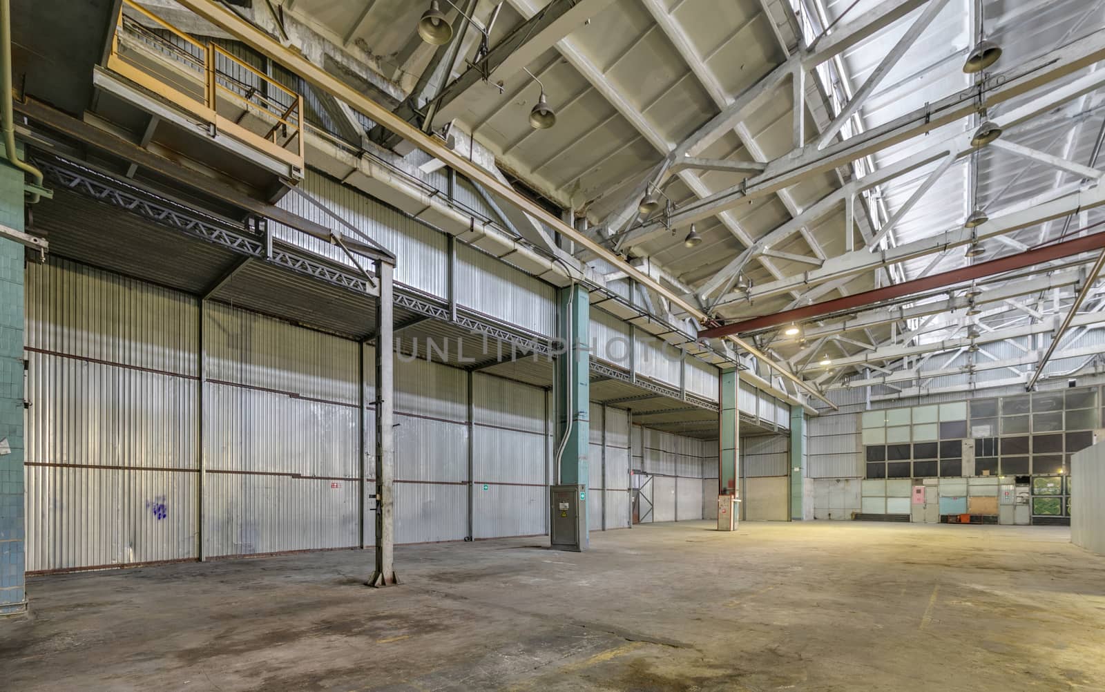 The interior of an empty production hall. General view of the plant workshop.