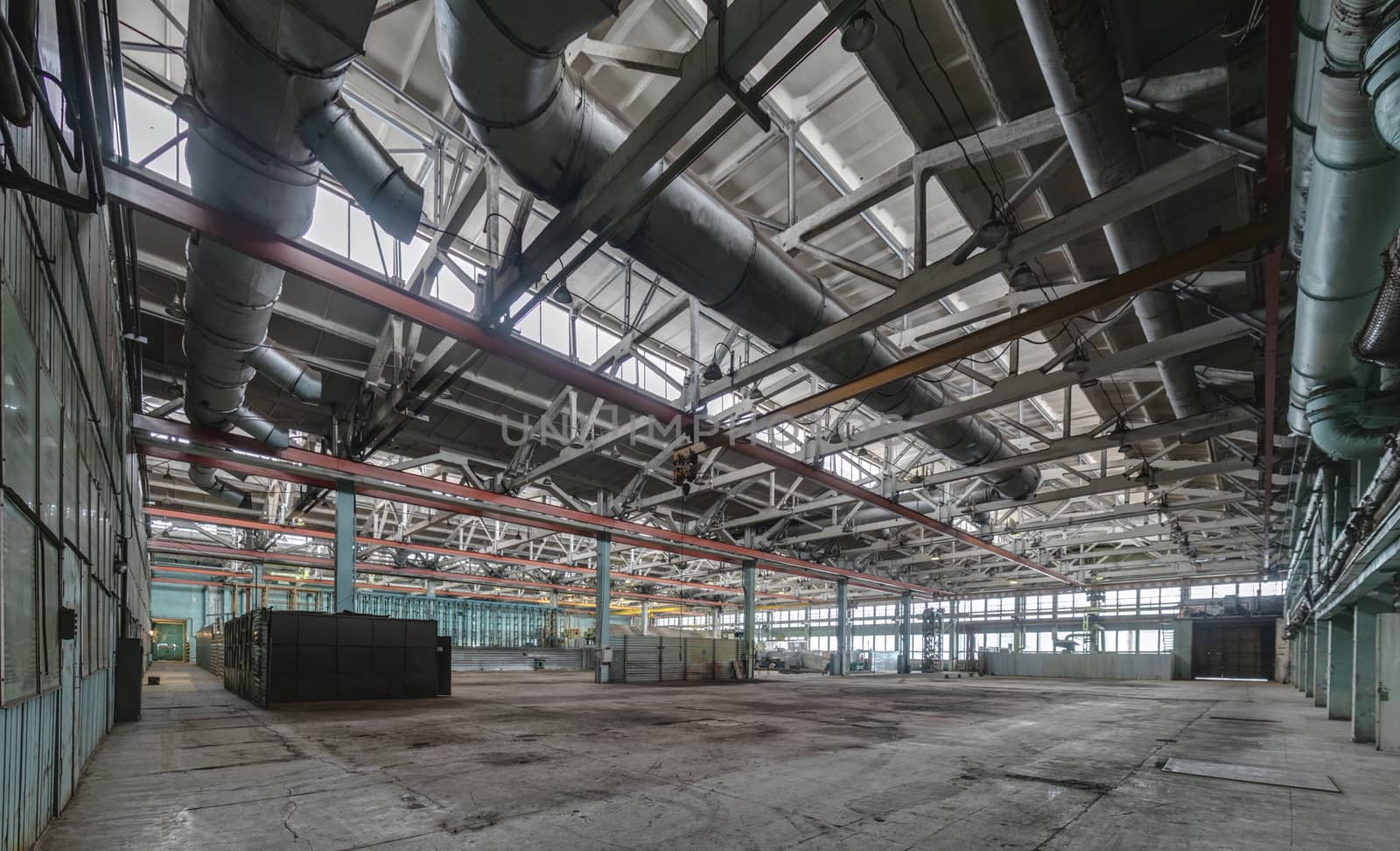 The interior of an empty production hall. General view of the plant workshop.