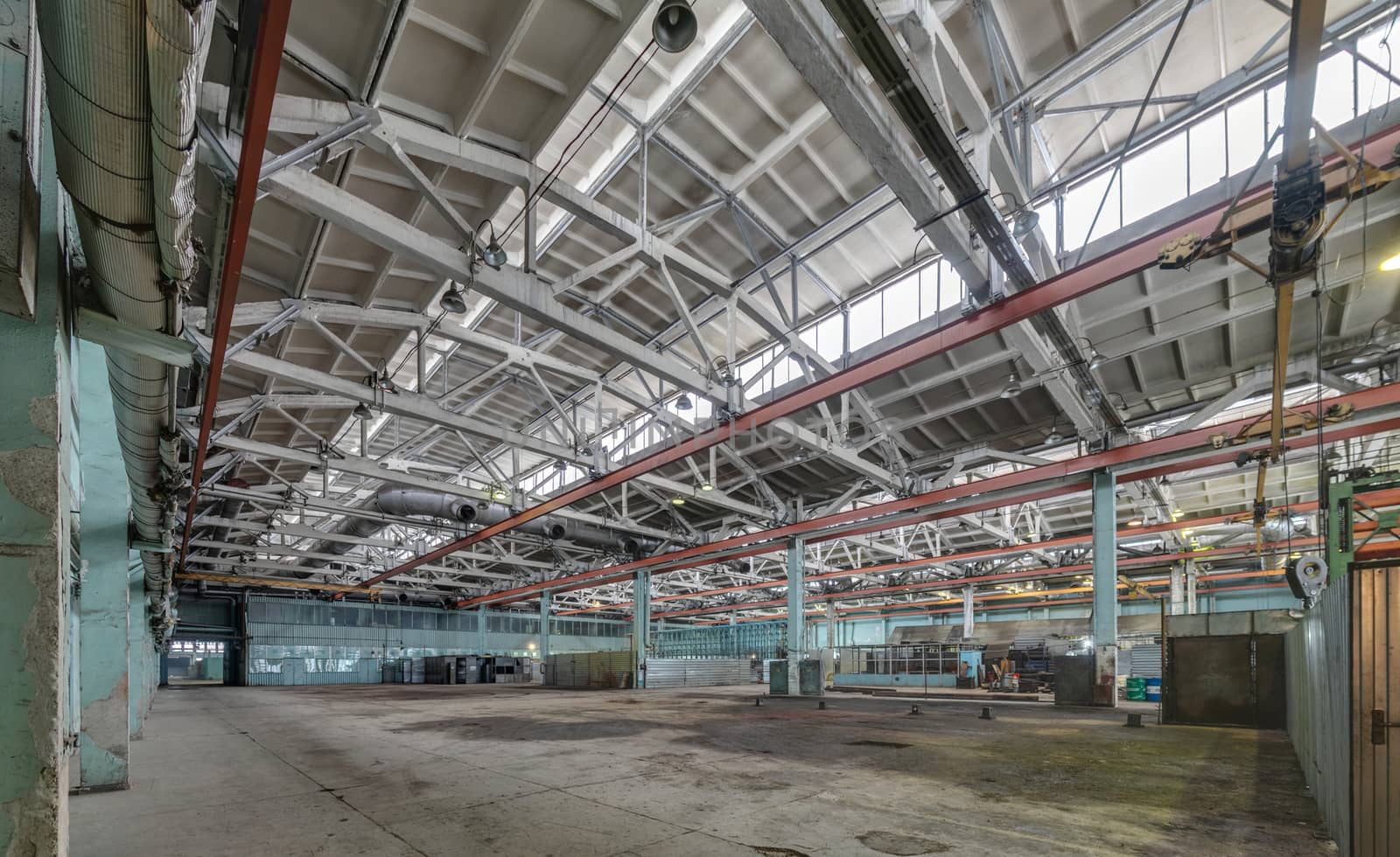 The interior of an empty production hall. General view of the plant workshop.