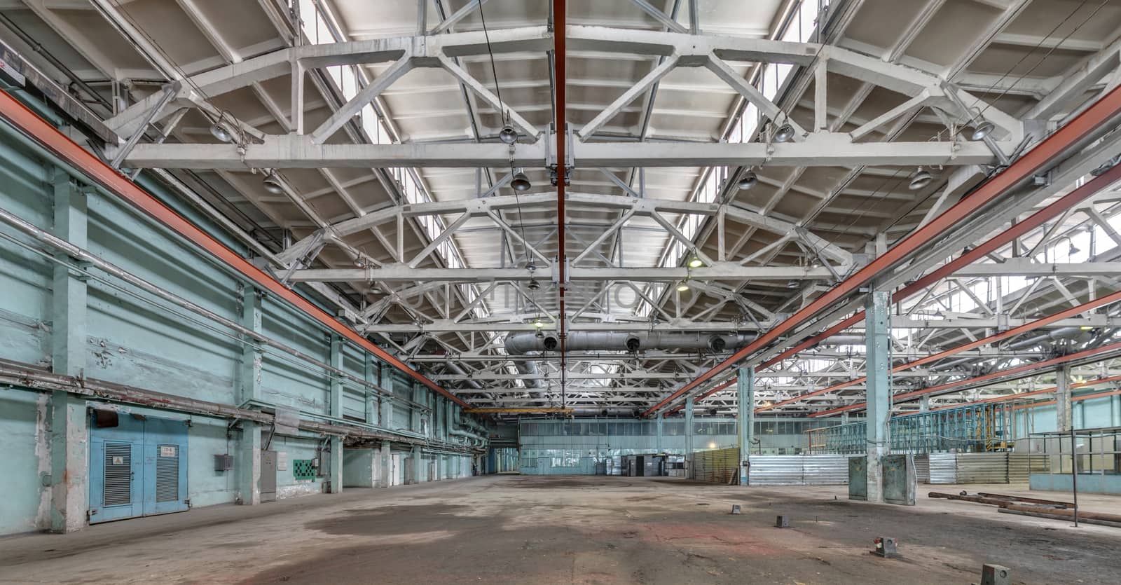 The interior of an empty production hall. General view of the plant workshop.