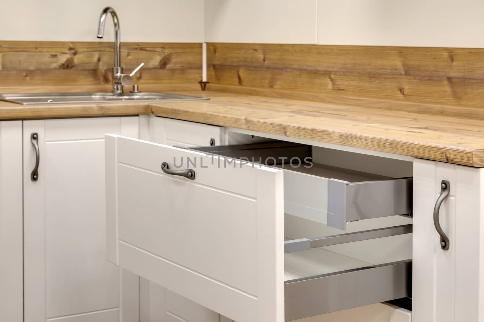a kitchen interior with drawers by sveter
