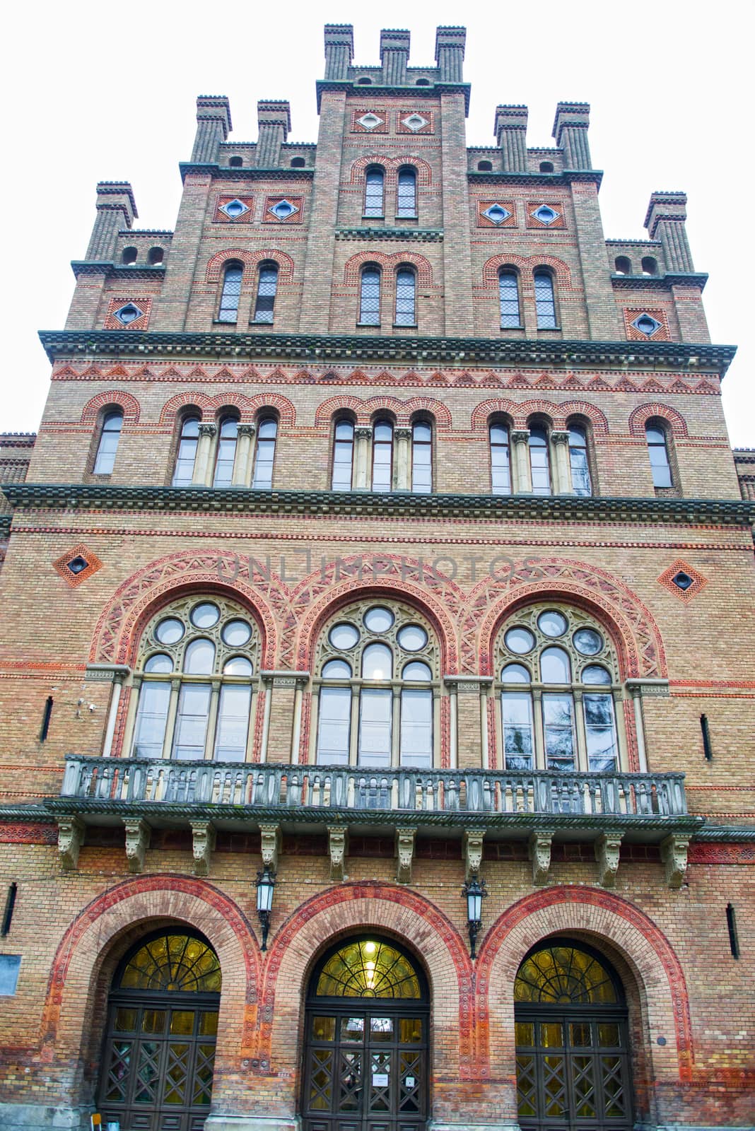 Arched windows, red brick building ornamental details at Chernivtsi National University, unesco heritage site