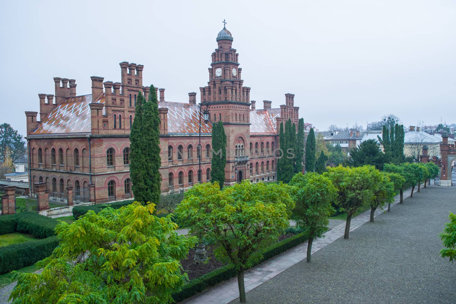The building of Chernivtsi National University with garden in front, unesco heritage site