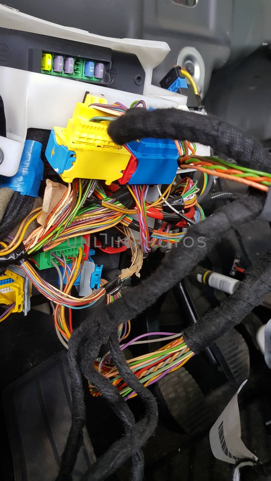 Car electrical system, engine control unit (many wires and some fuses).
