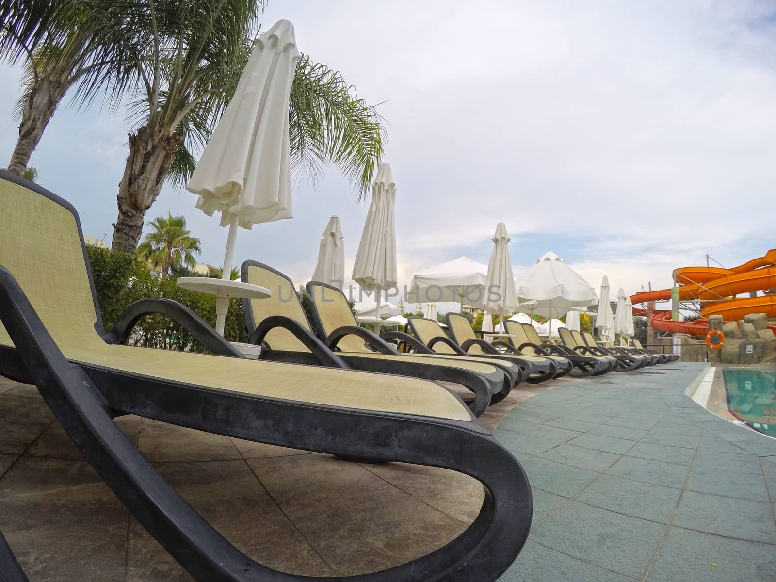 Chaise longue at the swimming pool in a mediterranean resort