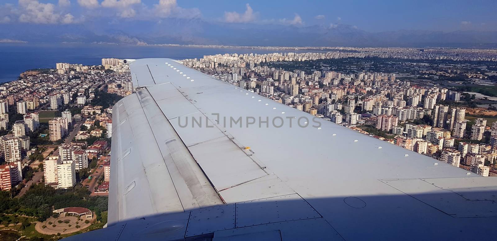 Flying airplane above Antalya, prepairing for landing.
