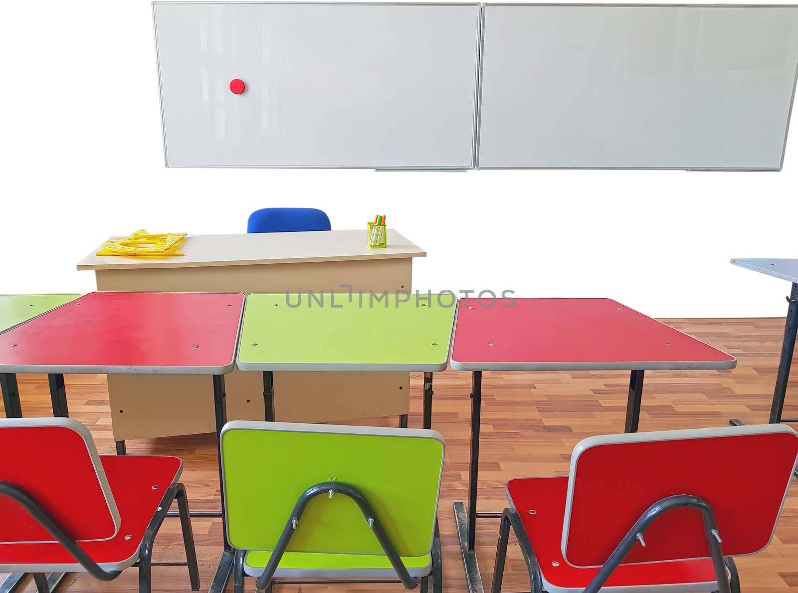 Empty school classroom> teachers desk, pupils tables and seats and wall white board