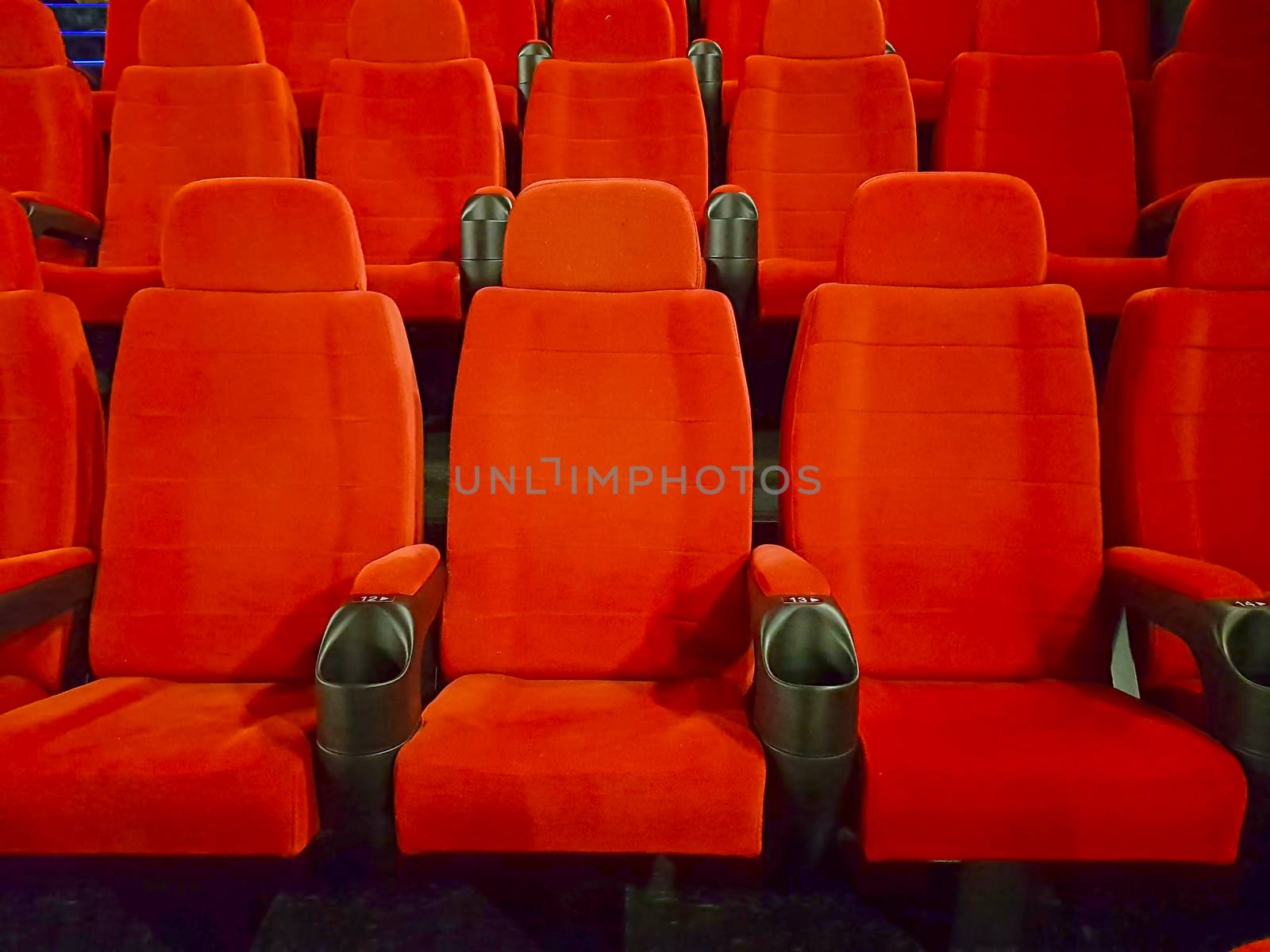 Comfortable empty red seats in a cinema hall