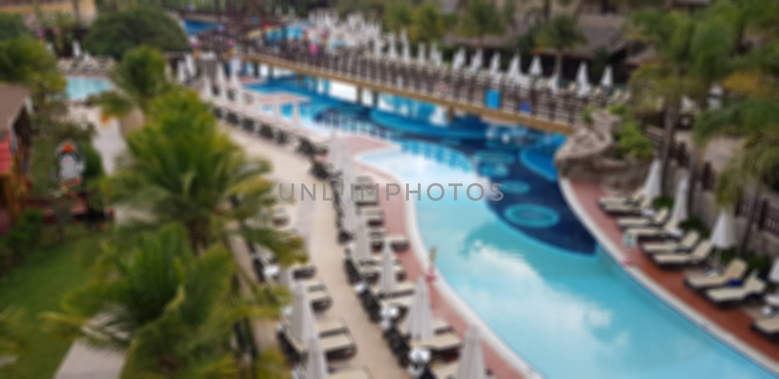 Abstract blur of tropical pool, exotic vacation concept by savcoco