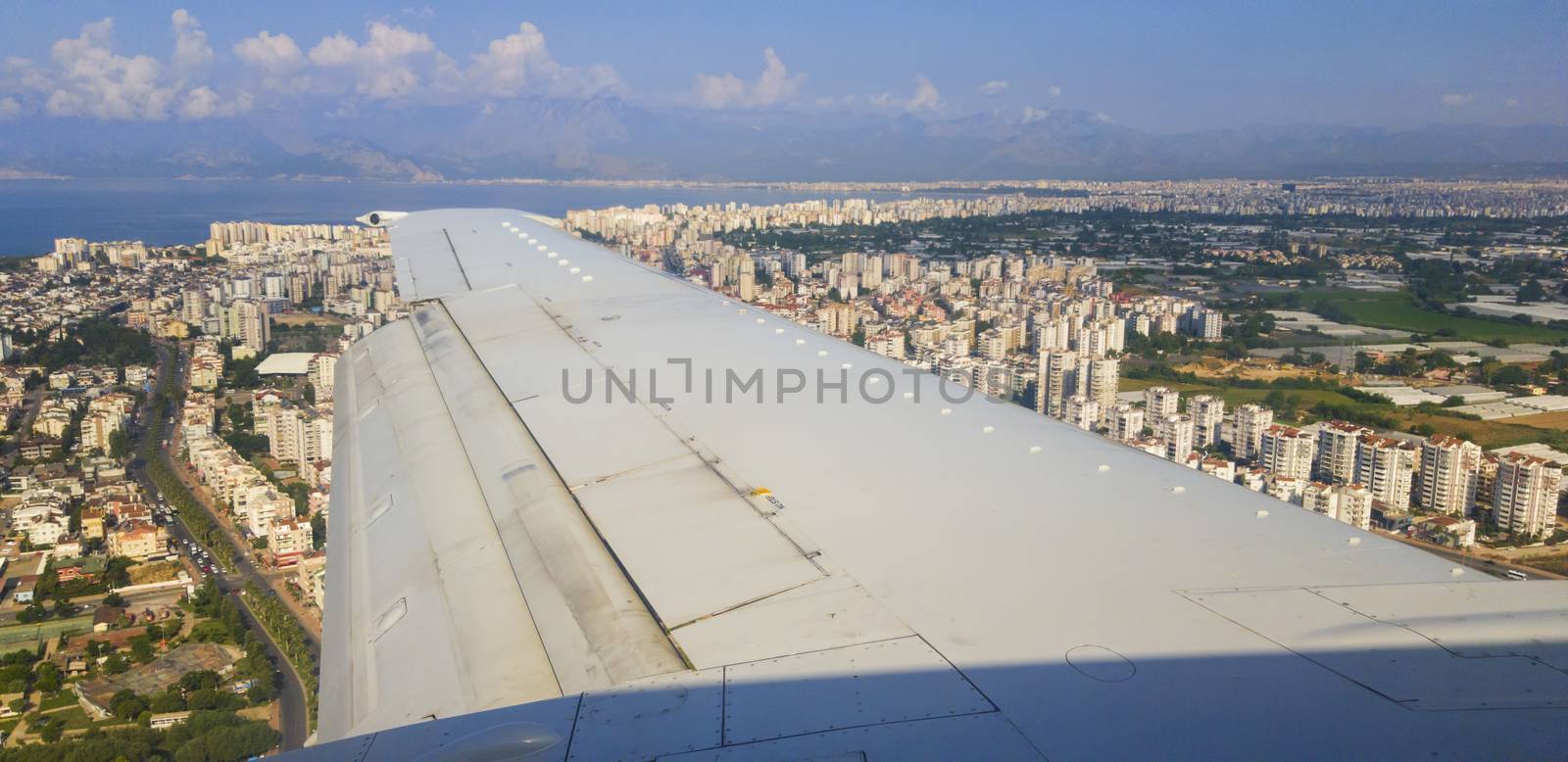 Flying airplane above Antalya, prepairing for landing.