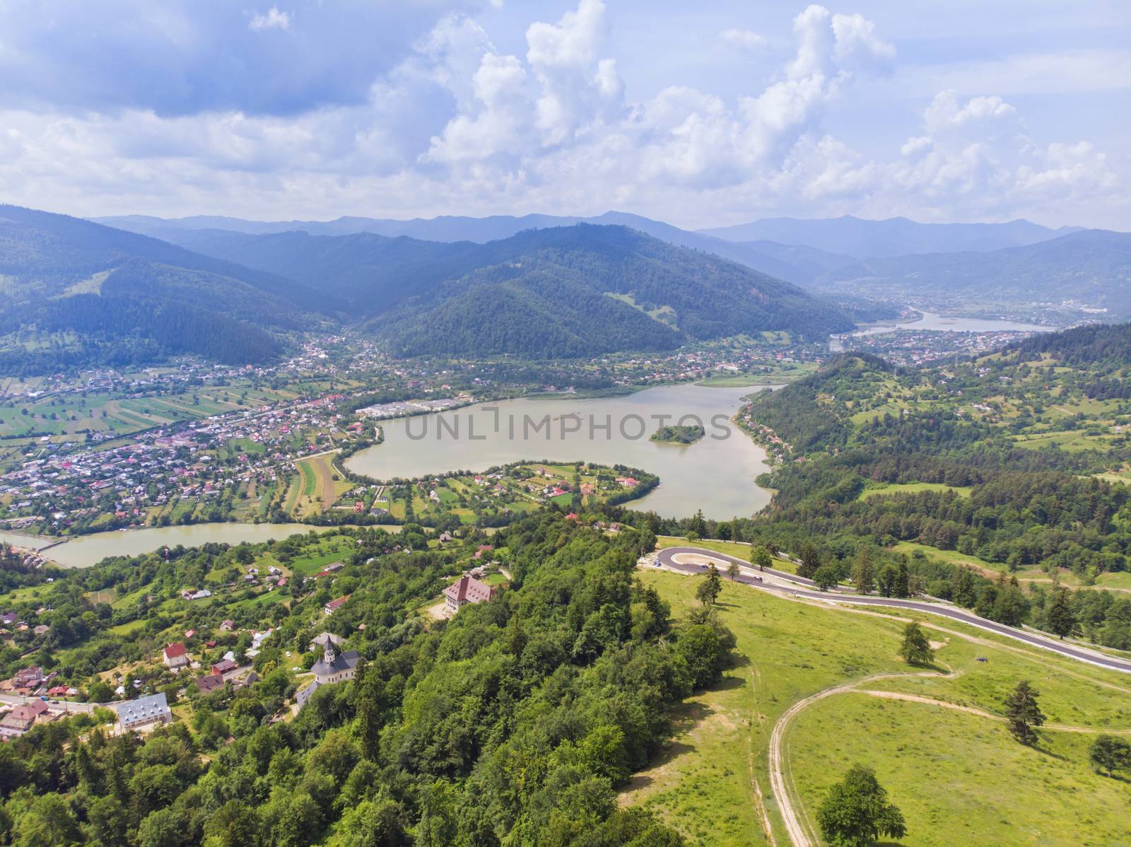 Aerial view to Bistrita river valley, some villanges with green fields  and the forest.