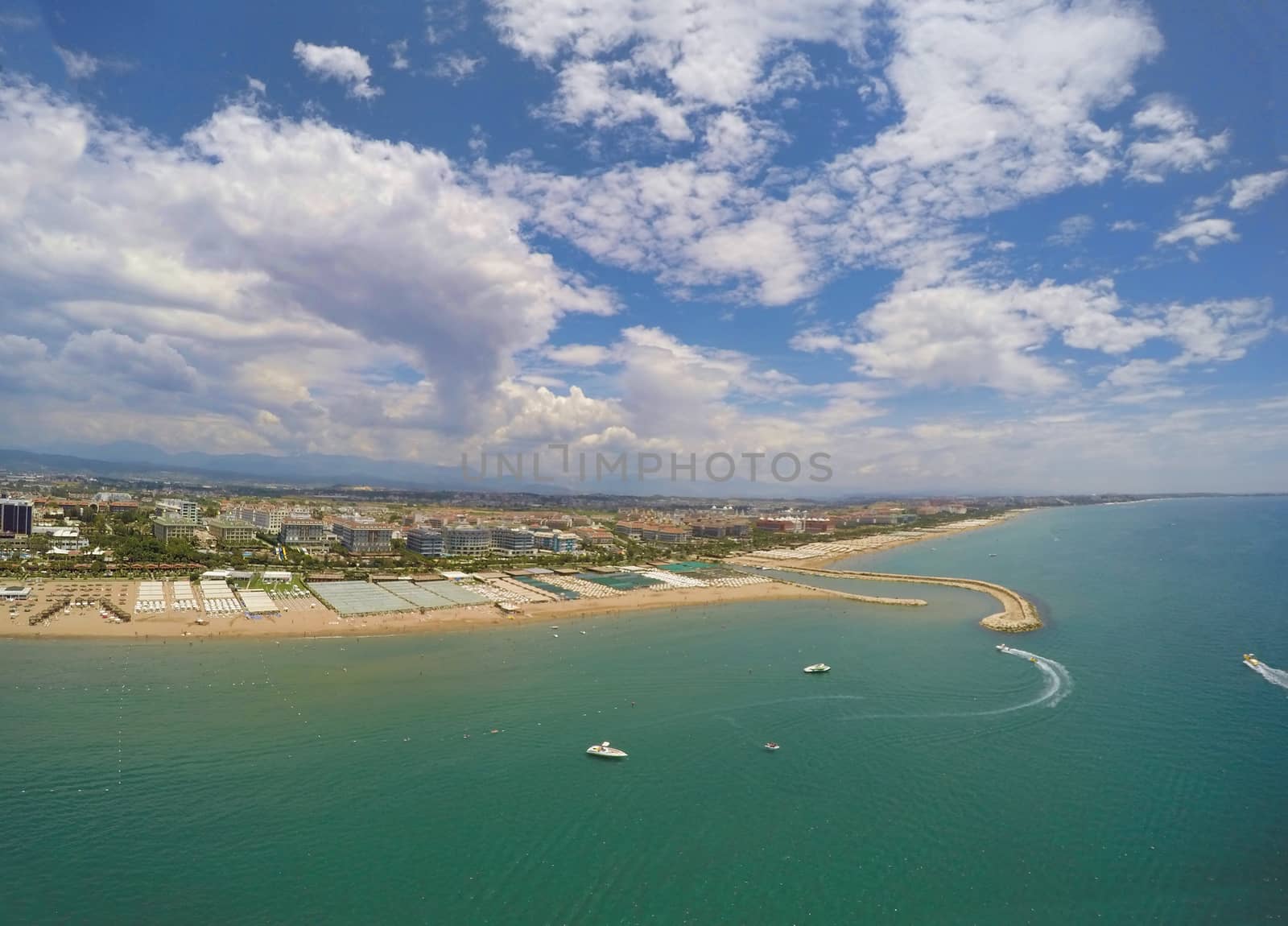 Mediterranean summer resort In Antalya, Turkey. Aerial view of beach and resort.