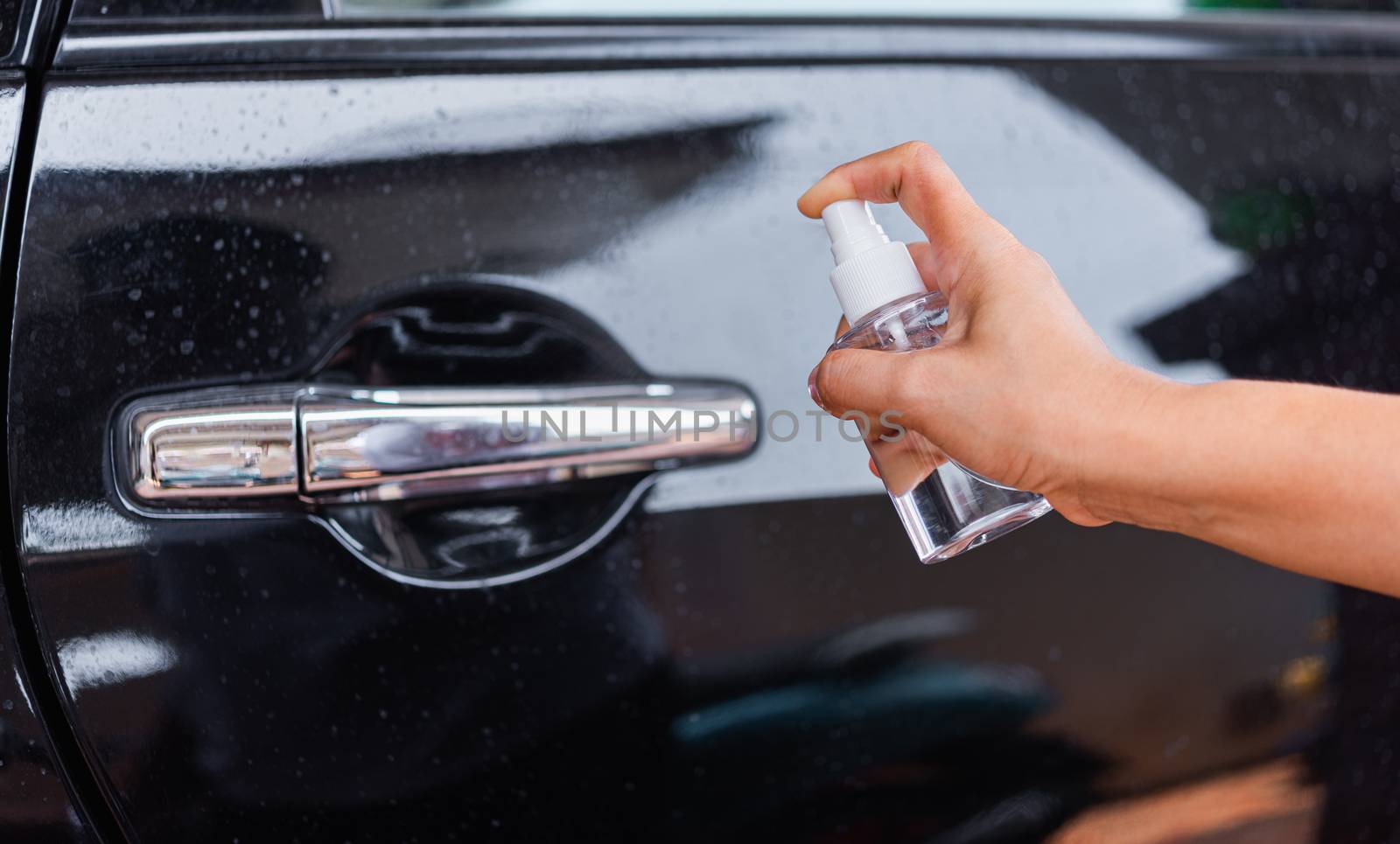 woman applying press dispenser sanitizer alcohol spray squirt to by Sorapop