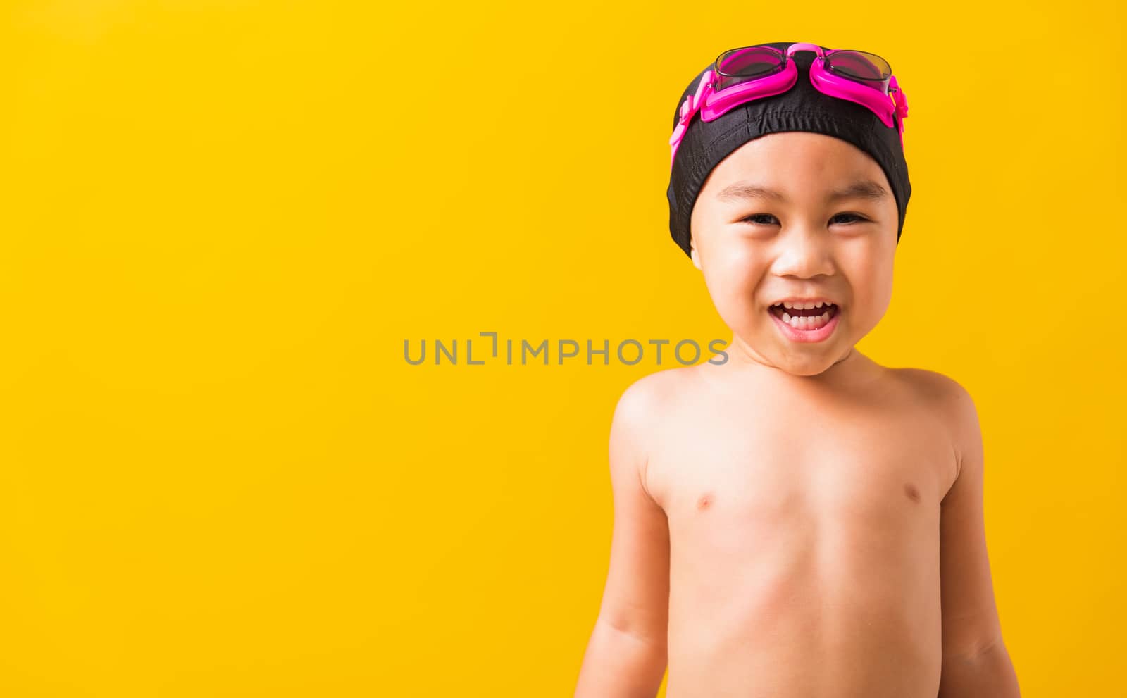 little child boy wearing goggles and swimsuit by Sorapop