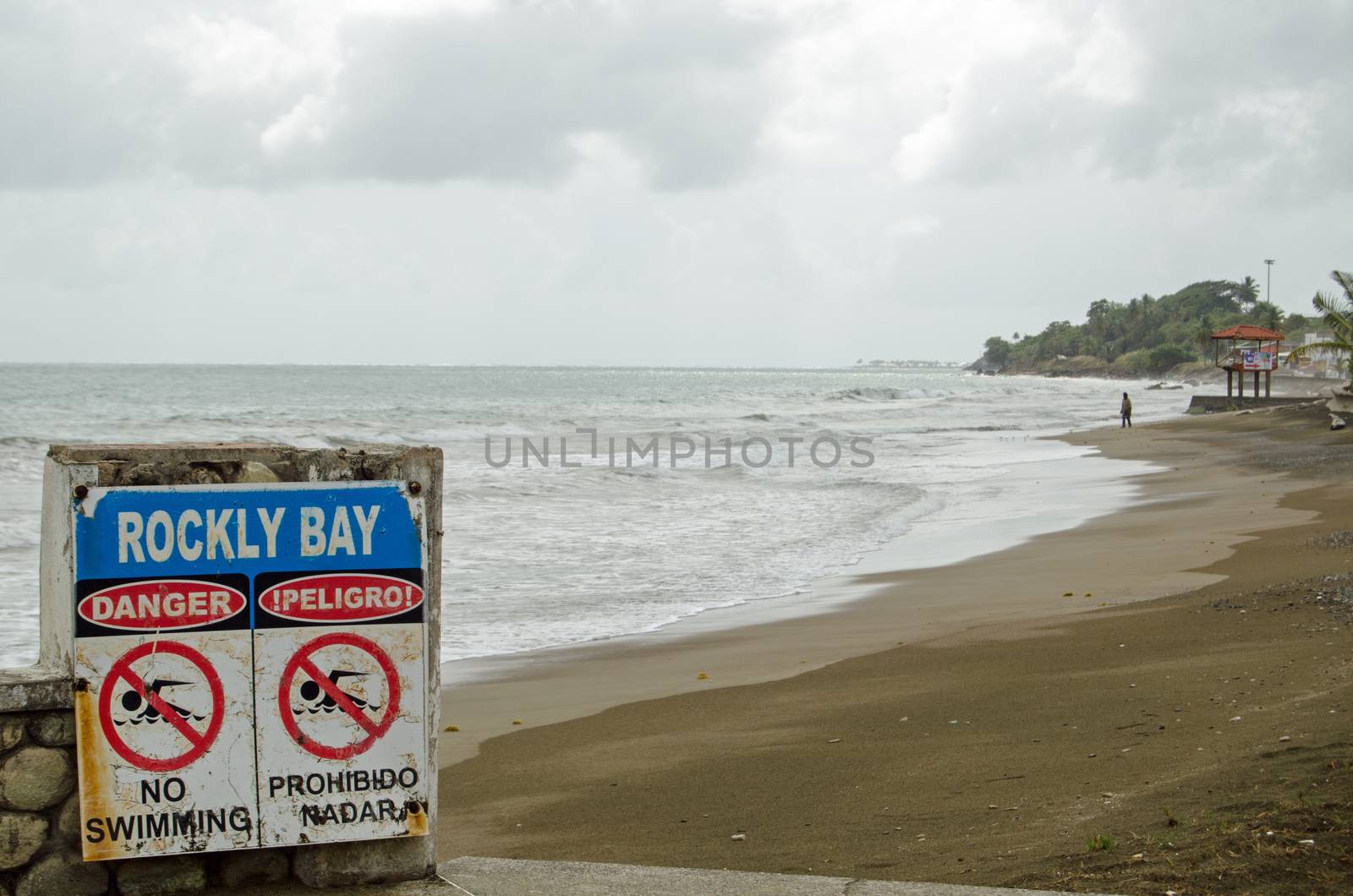 Waves on Rockly Bay, Scarborough on a cloudy afternoon on the island of Tobago, Trinidad and Tobago.