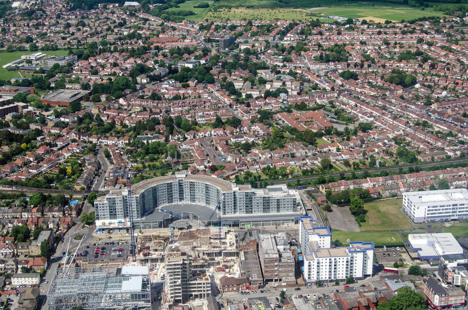 Aerial view of the London district of Hounslow with the landmark Blenheim Centre shopping centre and Piccadilly Line in the middle of the image.