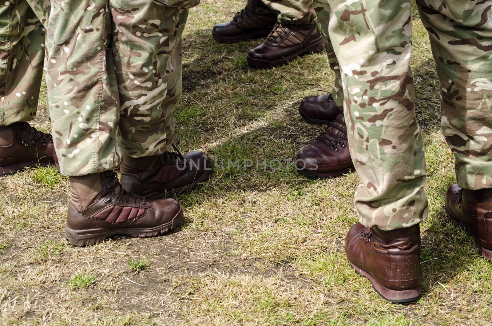 Brown boots worn by British soldiers with their camouflage uniform.