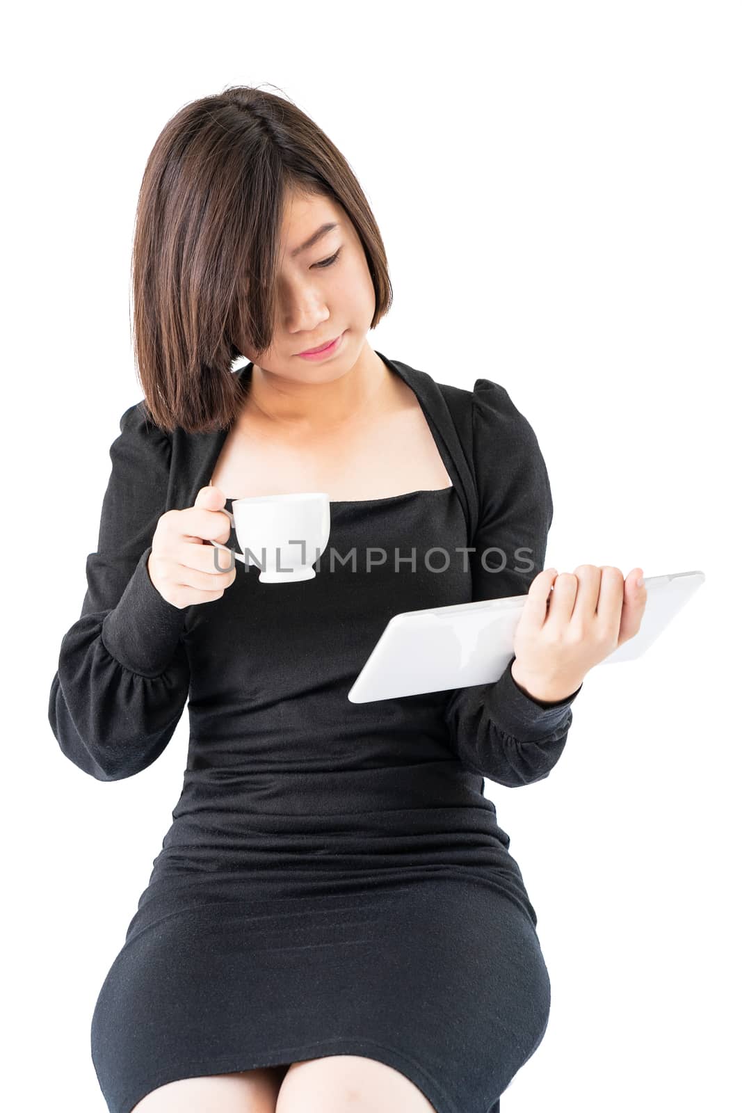 Young woman holding coffee cup and digital tablet isolated on white background