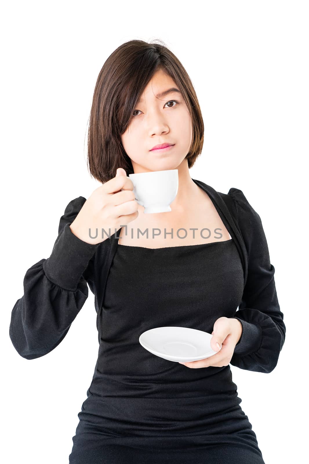 Young woman sittng holding coffee cup on white background