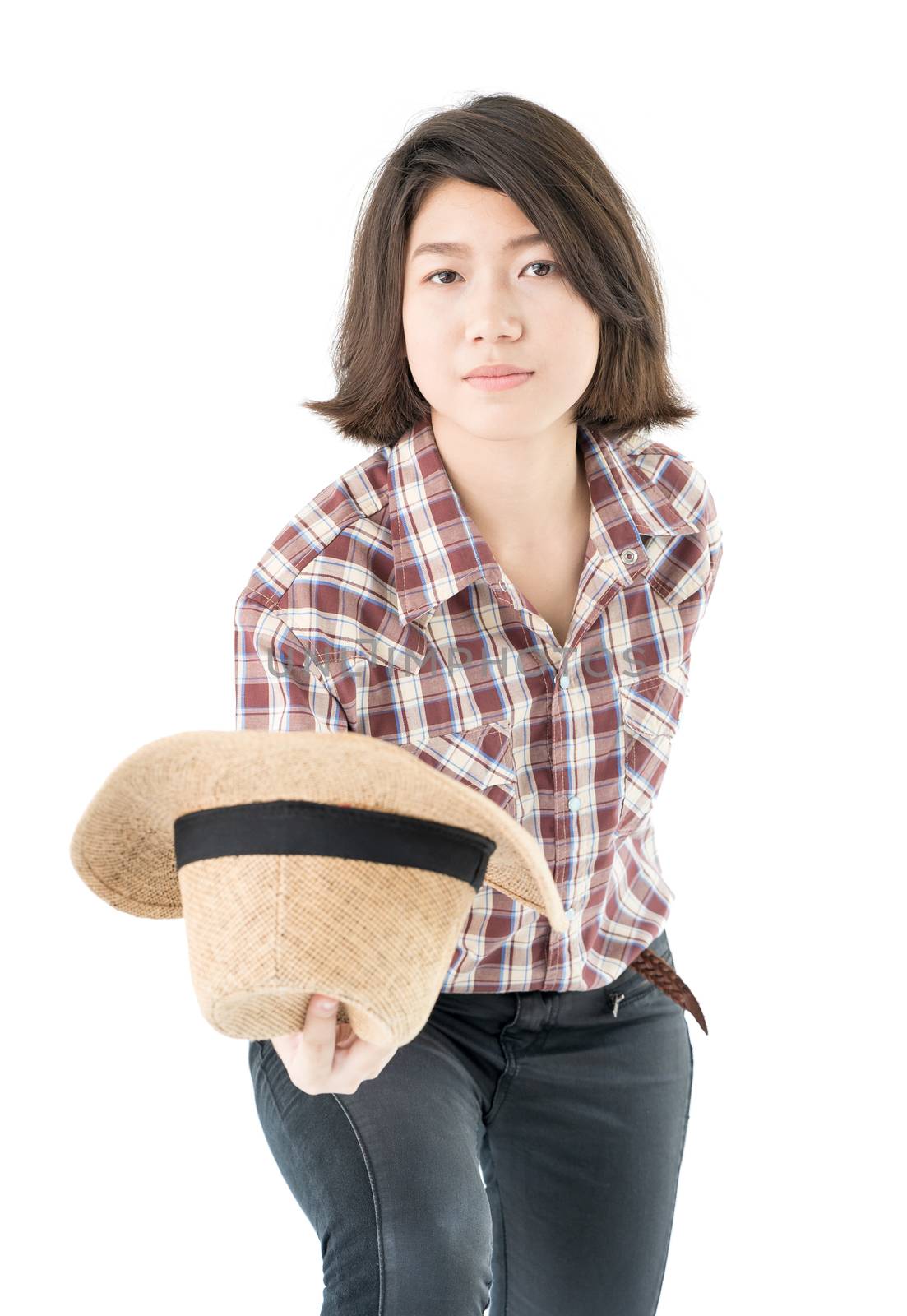 Young woman in a plaid shirt posing in studio on white backgroun by stoonn