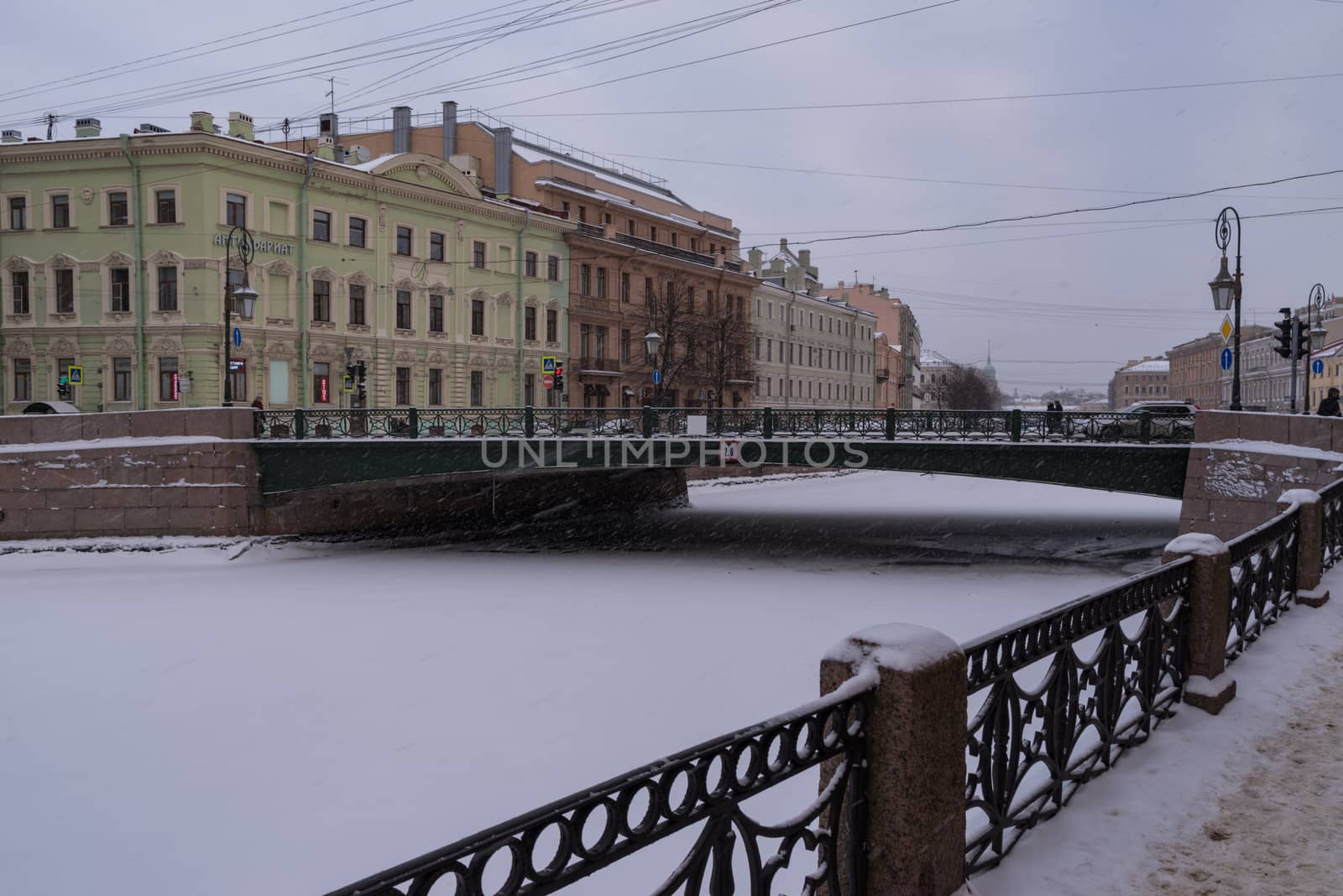 Saint Petersburg, Russia - January 5, 2019:  Embankment of ice covered Moyka river in snow weather. Saint Petersburg. Russia