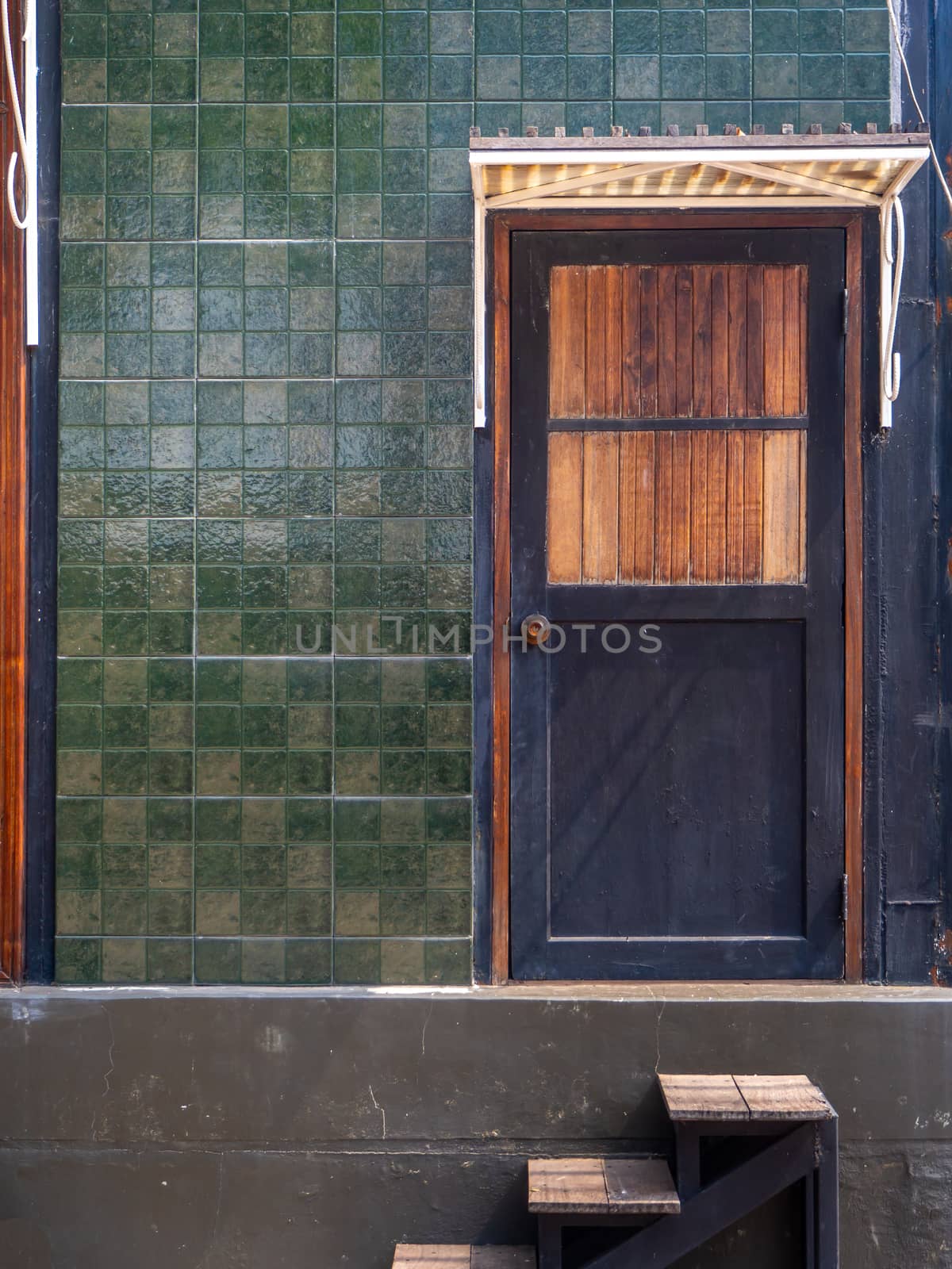 Horizontal of black front door to a family home; The door