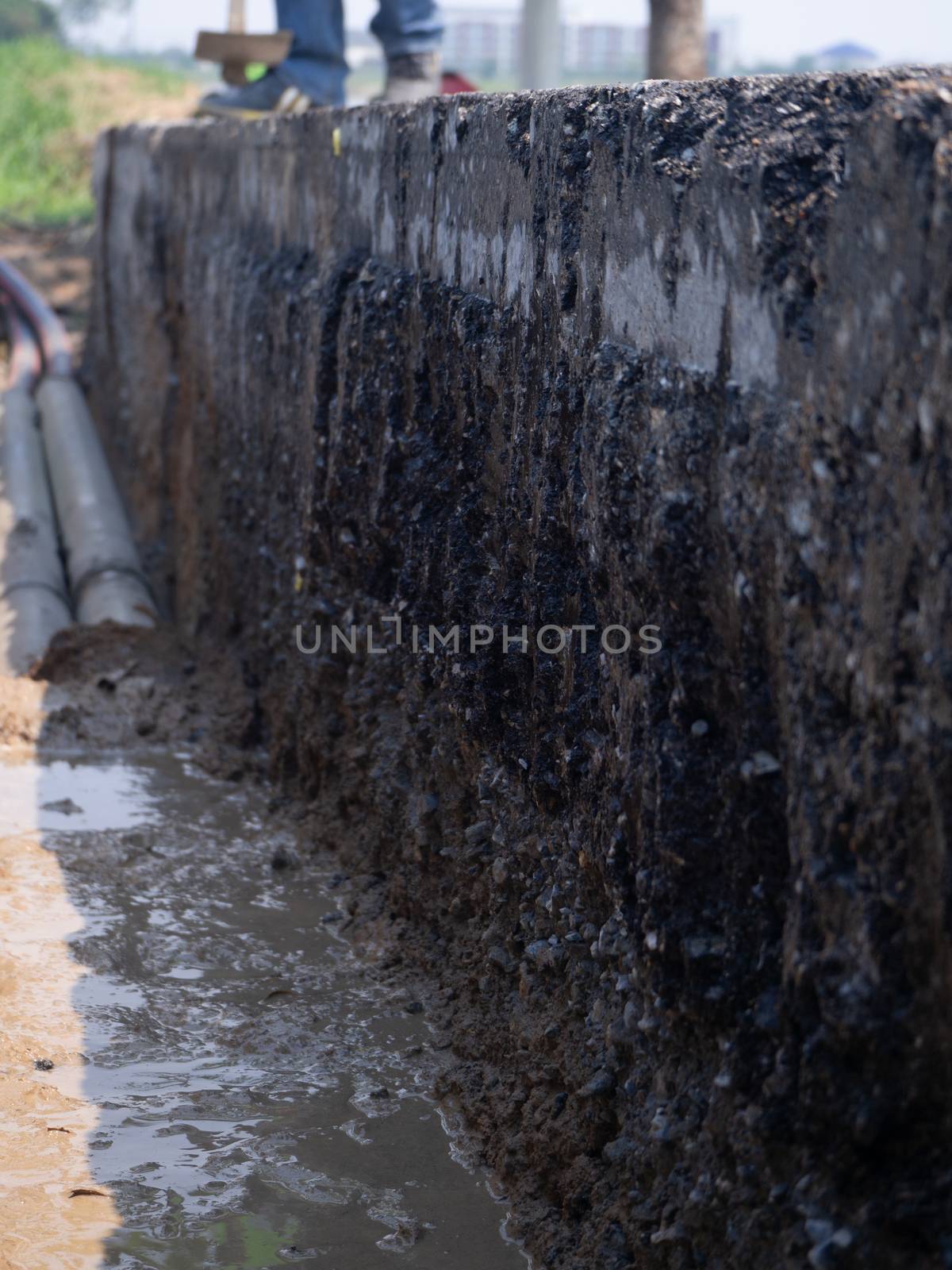 installing concrete drains on the side of the road