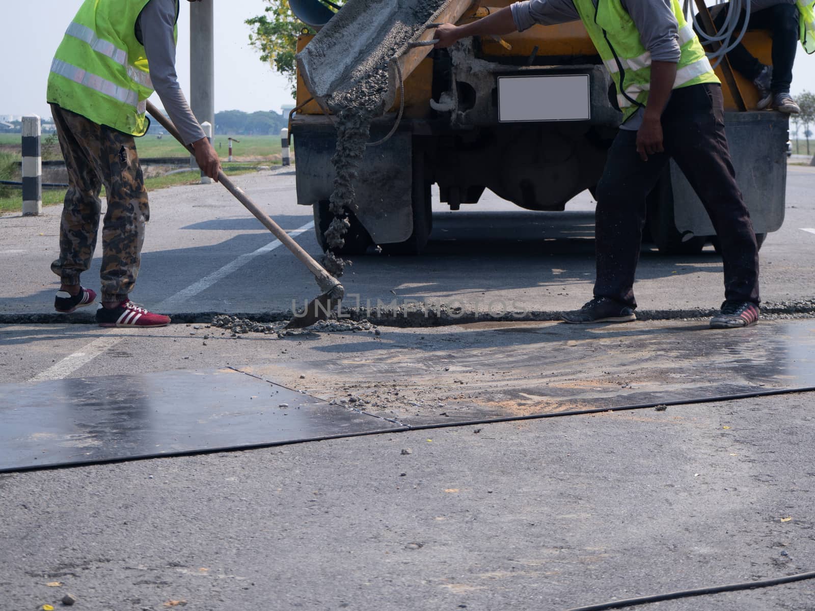 The Builders pouring cement during Upgrade to residential street.