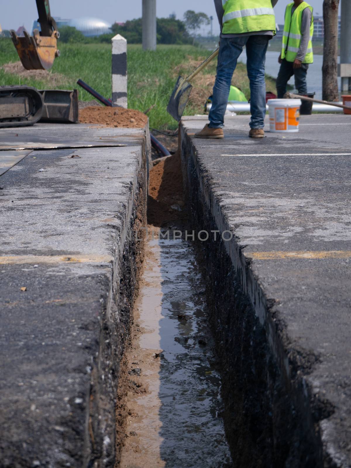 installing concrete drains on the side of the road