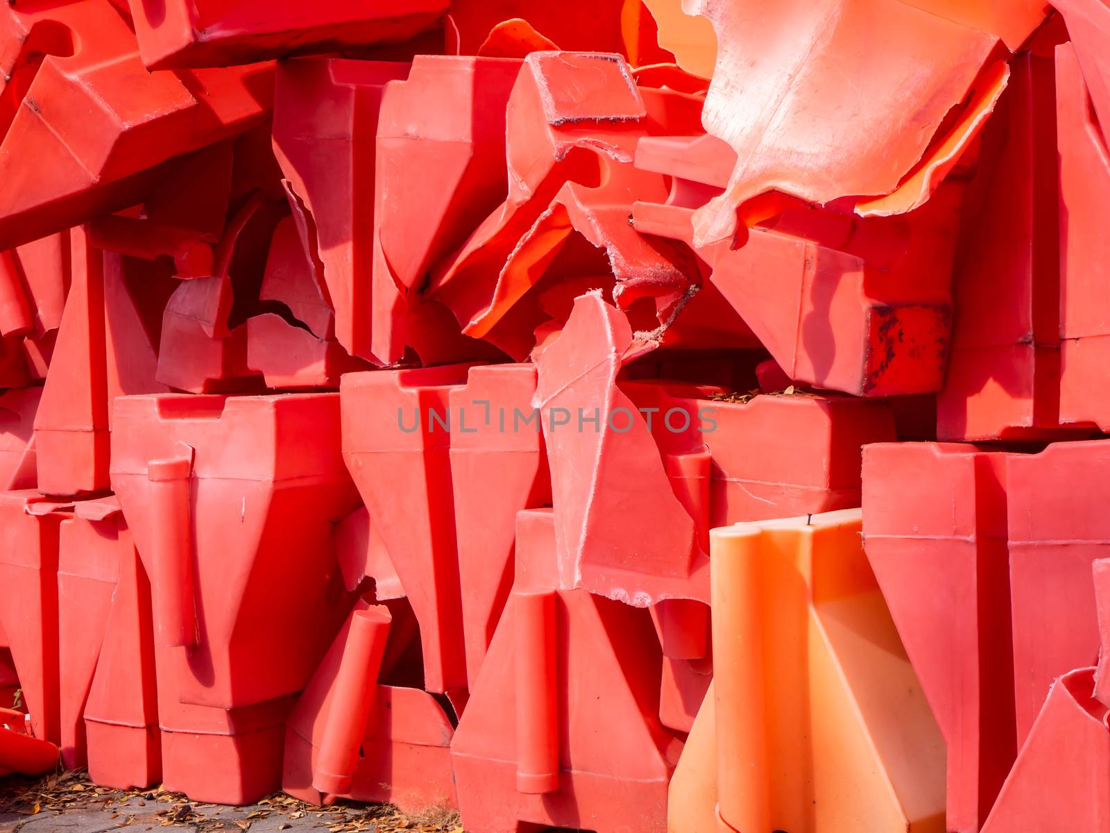 the orange traffic barrier barrels to detour traffic around construction zone shallow