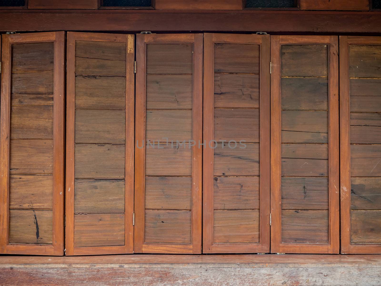 The wood wall and window on stones basement