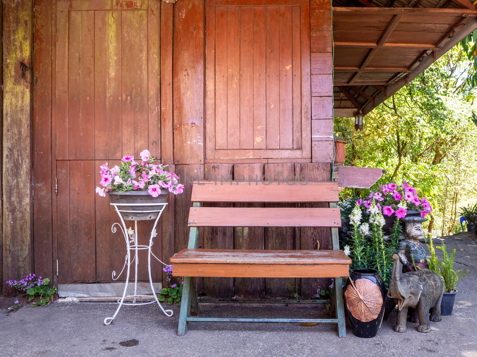 table and chairs standing on a lawn at the garden