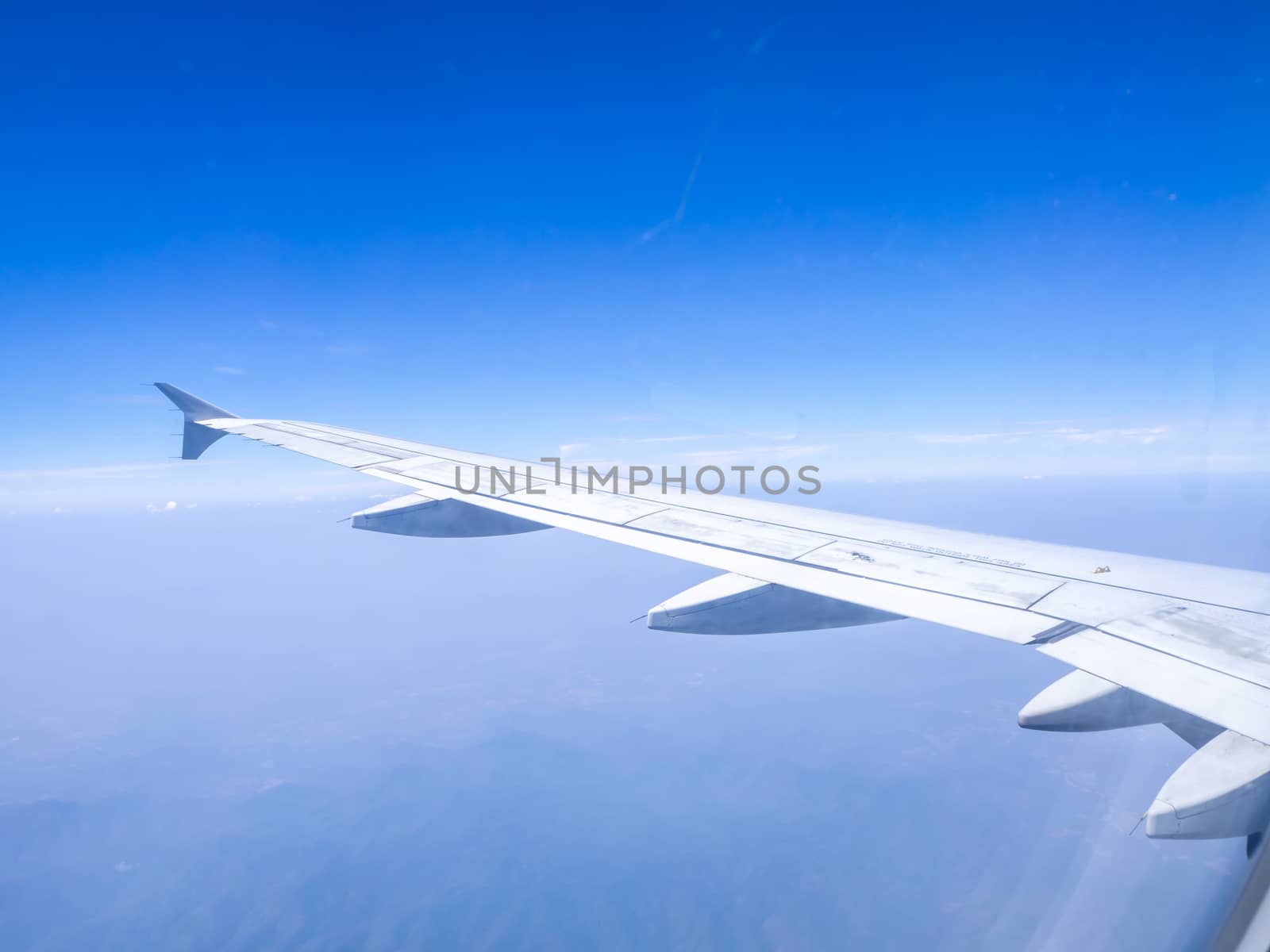 The looking at aircraft wing view from windows