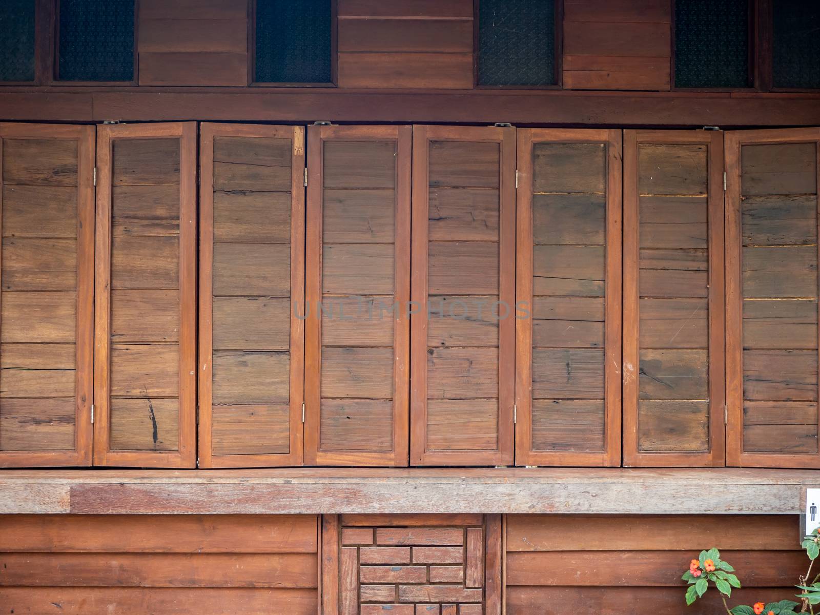 The wood wall and window on stones basement