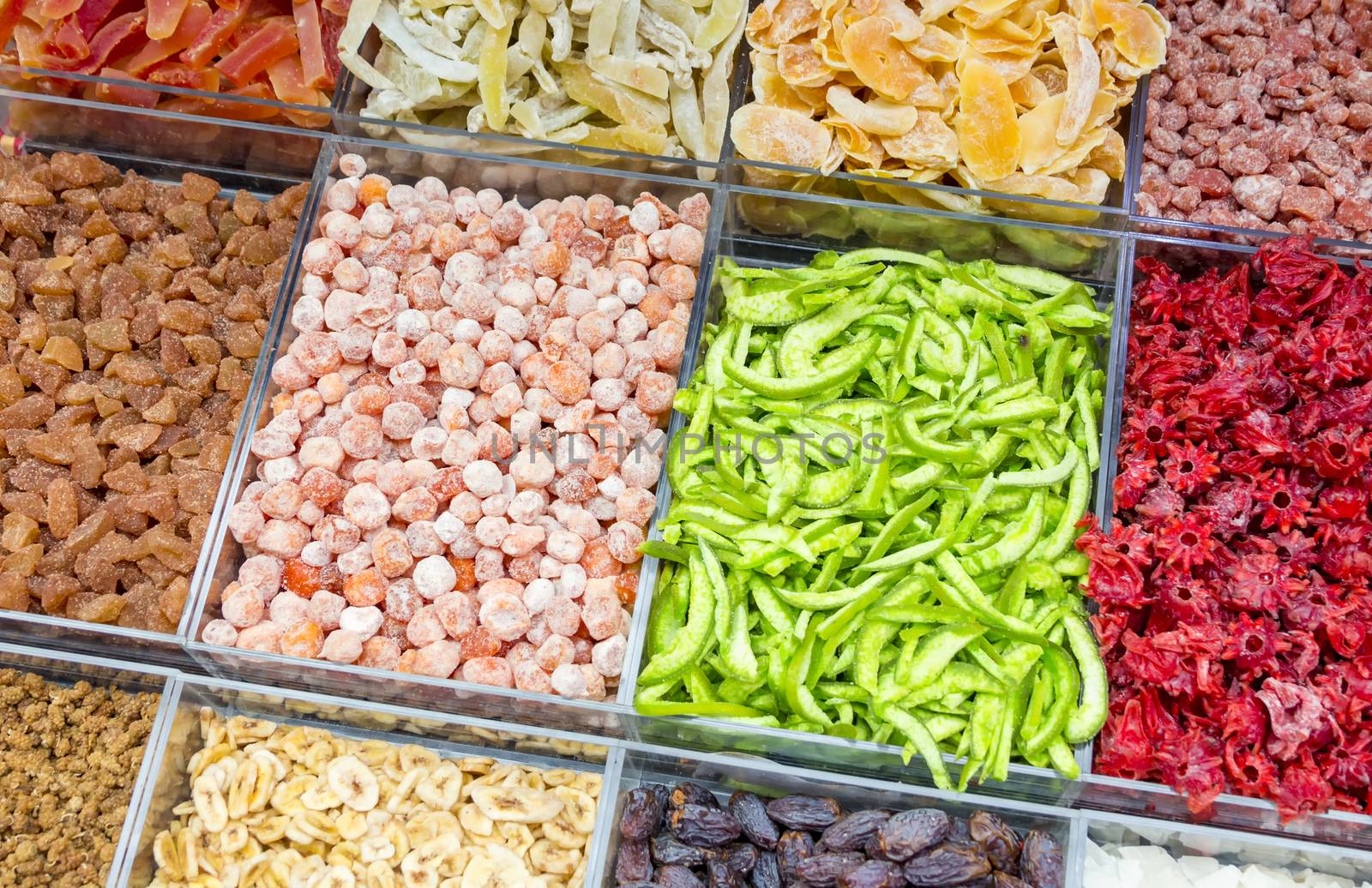 Color pattern made up of various types of vegetables and dried fruit at a market stall