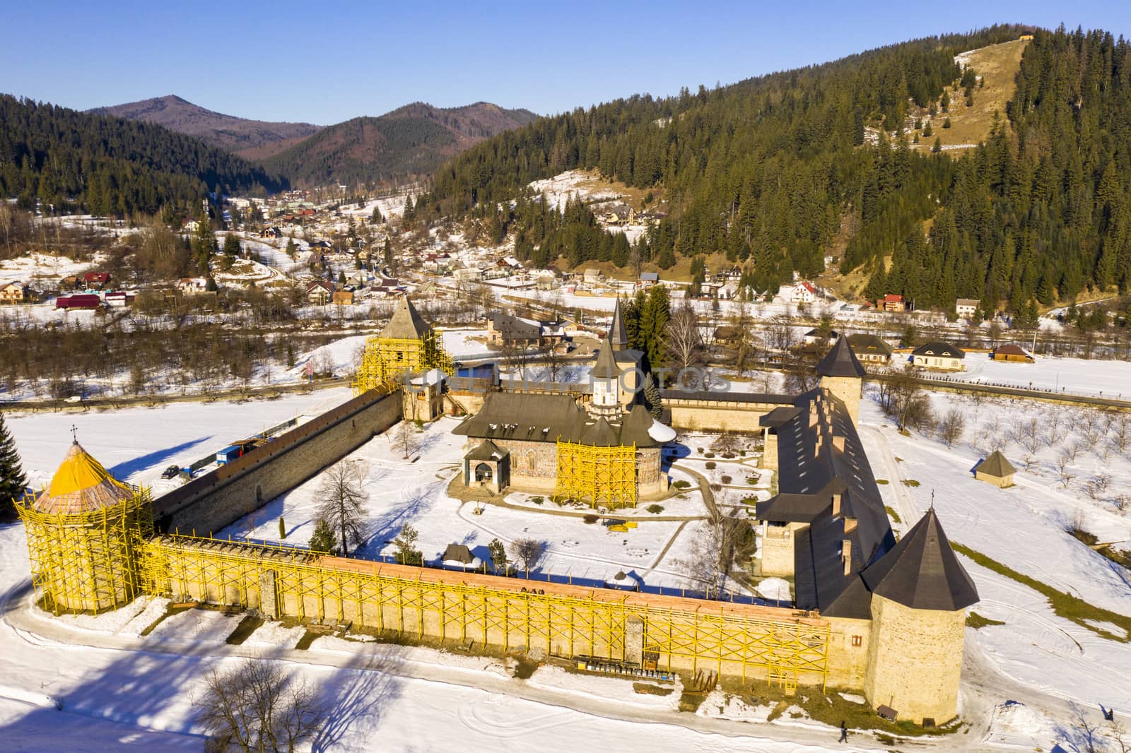 Sucevita monastery was built in 1585 and church paintings date around 1601. The church and surrounding walls are under repair and partial covered in ugly yellow scaffolding,