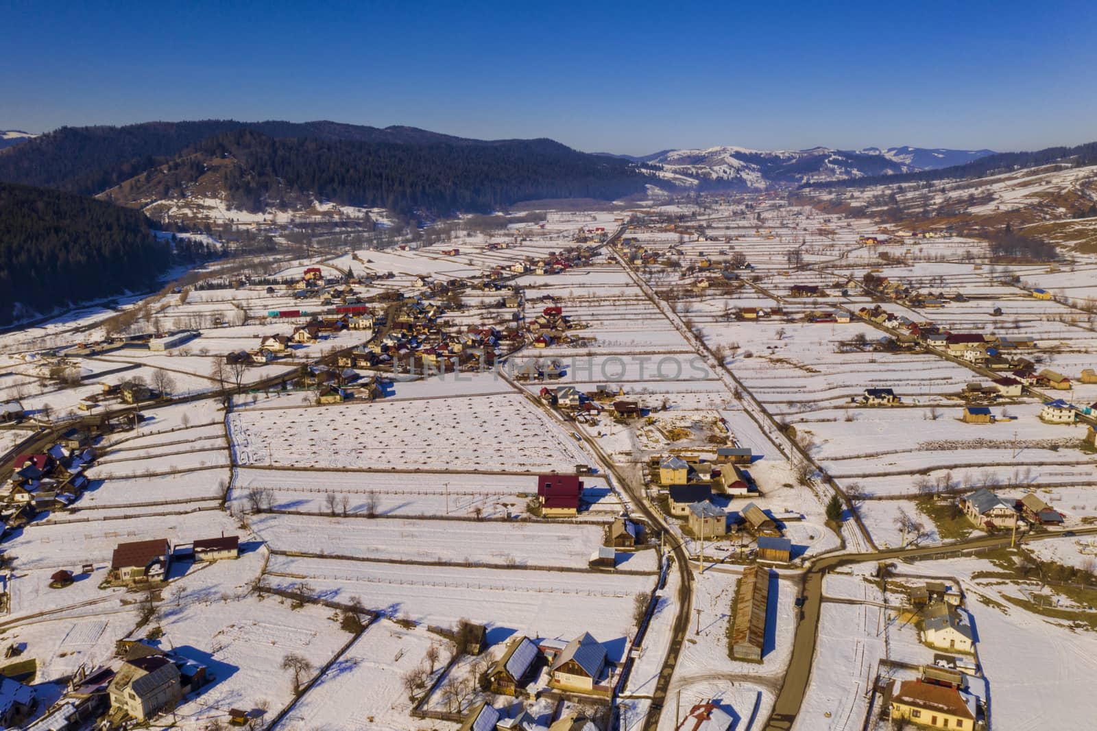 Aerial winter landscape of a traditional romanian village, Moldovita village in Moldavia
