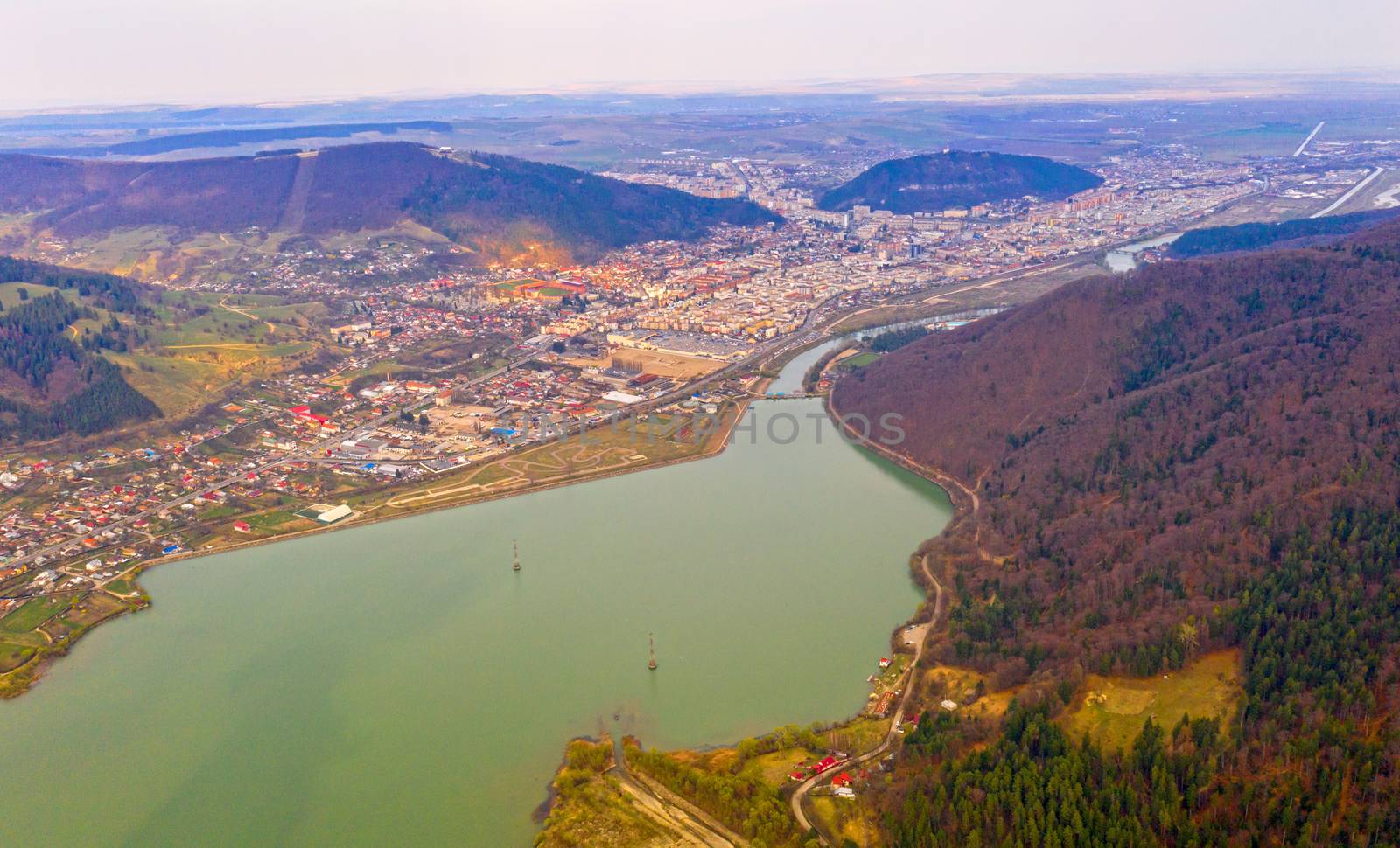 Drone view of small city in Romania, Piatra Neamt by savcoco