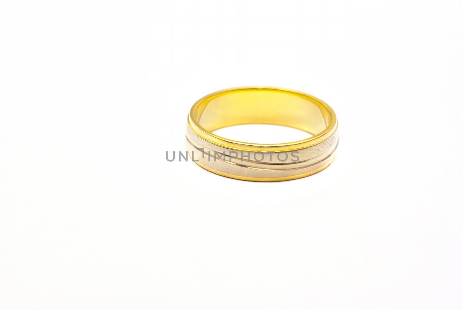 Close up image of a golden ring, yellow and white model