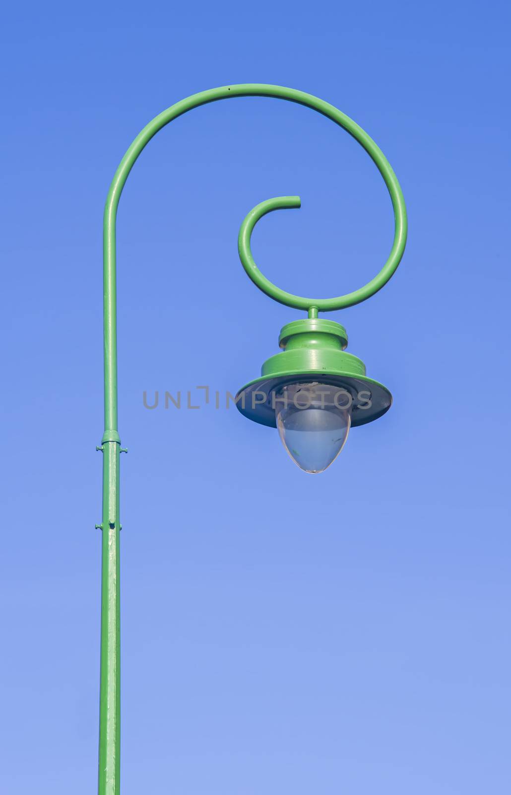 Street lamp on pillar with blue sky