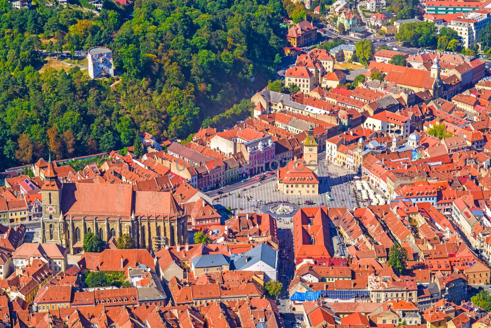 Aerial view of medieval city of Brasov, Romania; Black Church and Council Square, Famous touristic destination in Romania