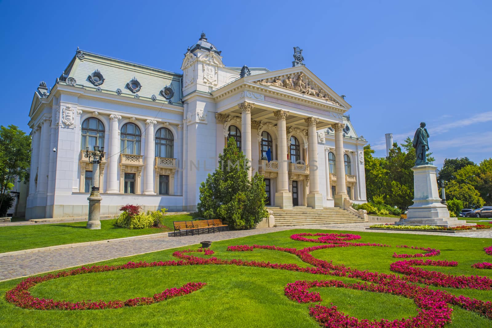 Iasi National Theatre building (19th century) and flower garden in Romania.