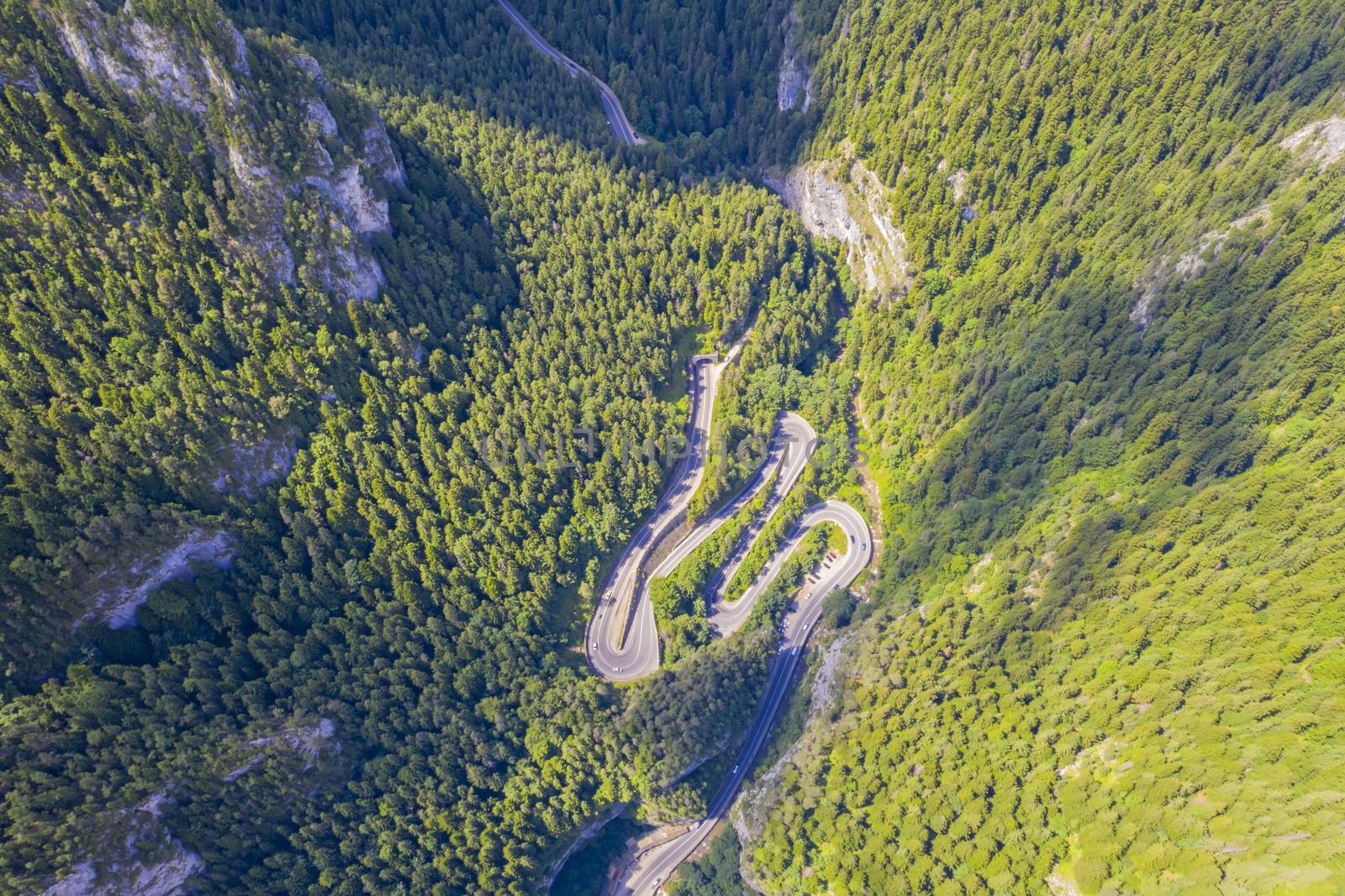 Rocky mountain and winding road, above view Bicaz Gorges in Romanian Carpathians.