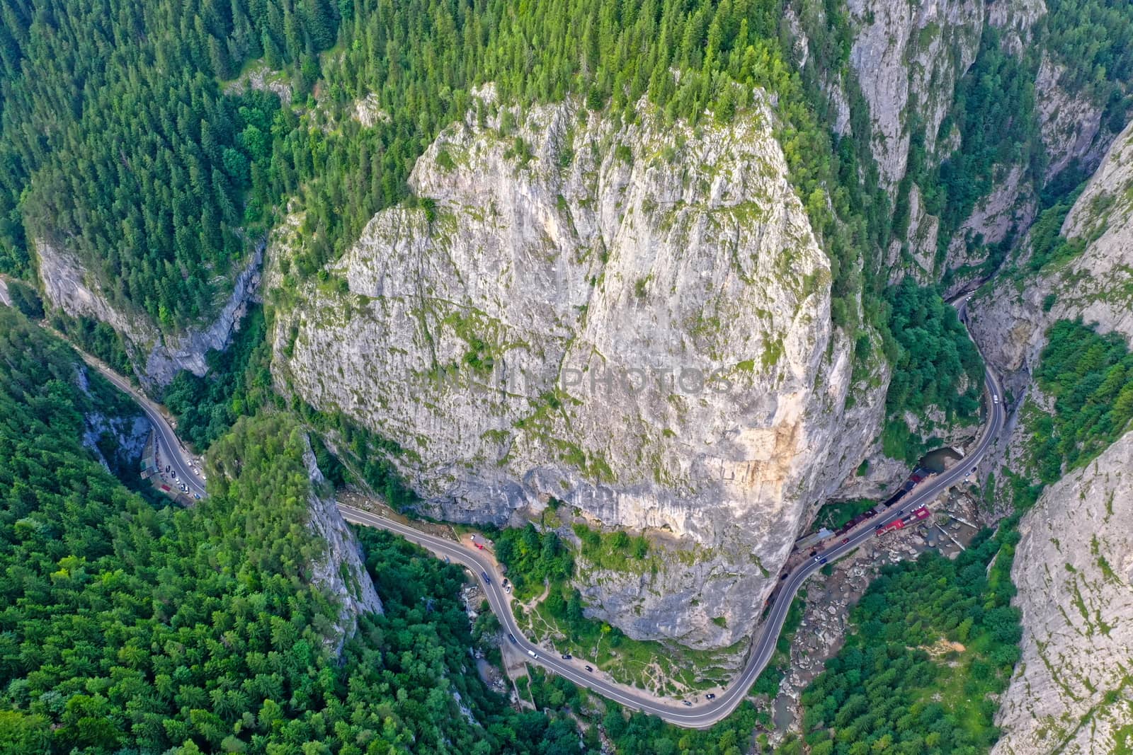 Rocky mountain pass in Romanian Carpathians, highway road near huge rocks