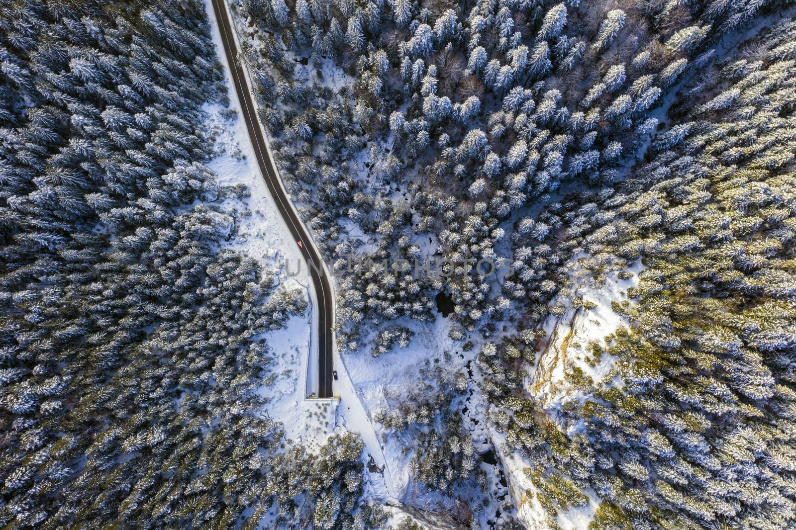 Winter road in tunnel entrance. Bicaz gorge is a narrow pass between two historical Romanian region.