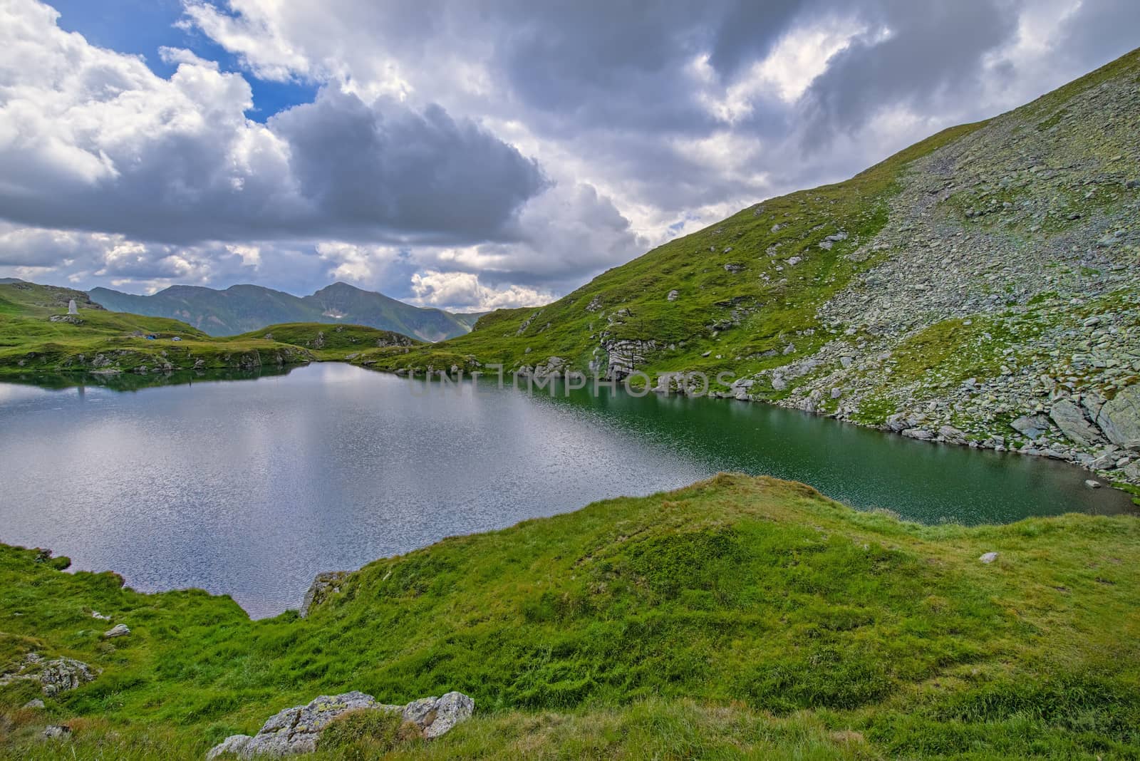 Glacier lake of Capra in Romanian Carpathians, summer scene